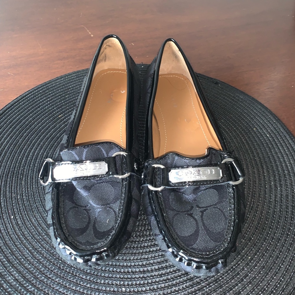 All black Coach loafers